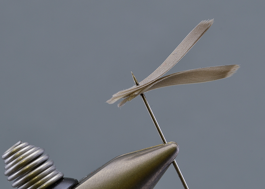 3. Stack the wing on a needle, starting with the two slips that will be facing towards you. Make sure to align the slips as perfectly as possible on the needle. You better get this right as there is no way of correcting anything once the wing is tied in...